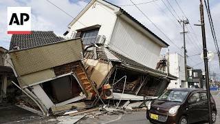Japan earthquake death toll rises to 13 as rescuers 'race against time'