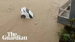 Cars swept away and trees toppled as Typhoon Noul brings flooding to southern China