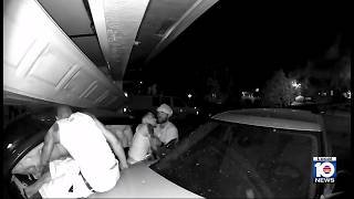 Video shows occupants fleeing after Tesla slams into garage