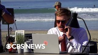 Man embraces remote work by setting up offices at the beach, baseball game