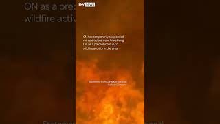 Train engulfed by wall of flames in Canada wildfire