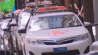 Debate online about whether sitting in the front seat of a taxi is acceptable