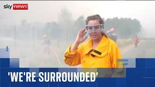 Sky reporter and firefighters surrounded by flames as wildfires spread across France