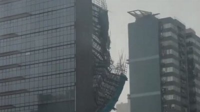 Scaffolding collapses from high-rise building as Typhoon Noul looms over Hong Kong