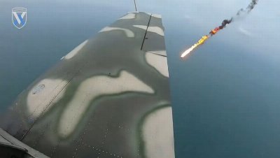 Ukrainian rear gunner shoots down attack drones with rifle from open cockpit