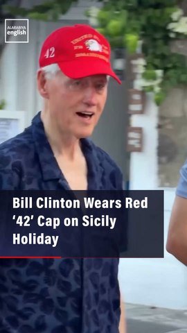 Bill Clinton Wears Red ‘42’ Cap on Sicily Holiday
