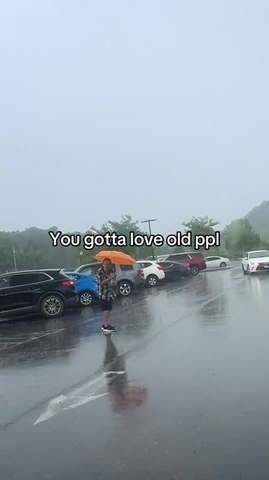 Man Walks With Closed Umbrella