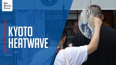 Tourists battle sweltering temperatures in Kyoto as heatwave grips west Japan