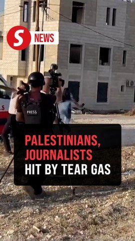 Israeli forces fire tear gas at Palestinians and journalists in area of shootout in West Bank