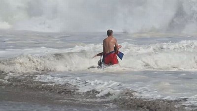 Dramatic rescue sees lifeguards battle terrifying waves to save boy off California