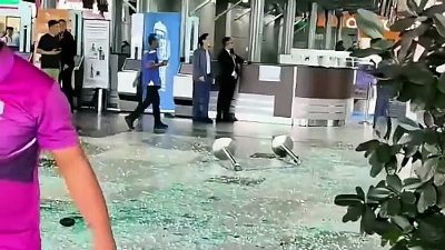 Woman injured after SUV crashes into KKIA departure hall entrance